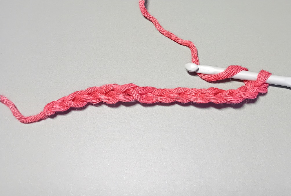 Looping the yarn around the crochet hook